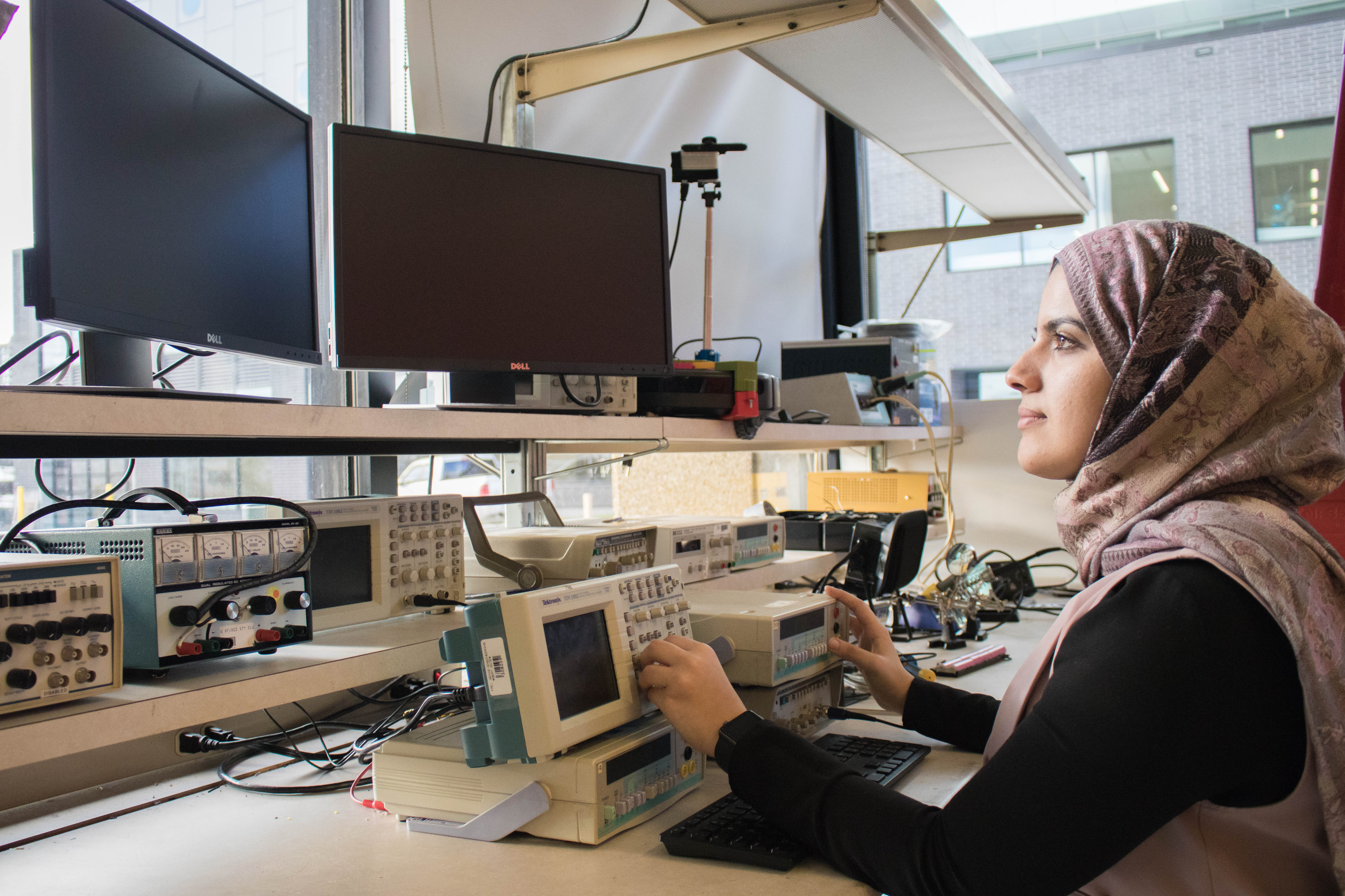 Student looking at computer screens